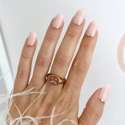 gold reverse french tip manicures