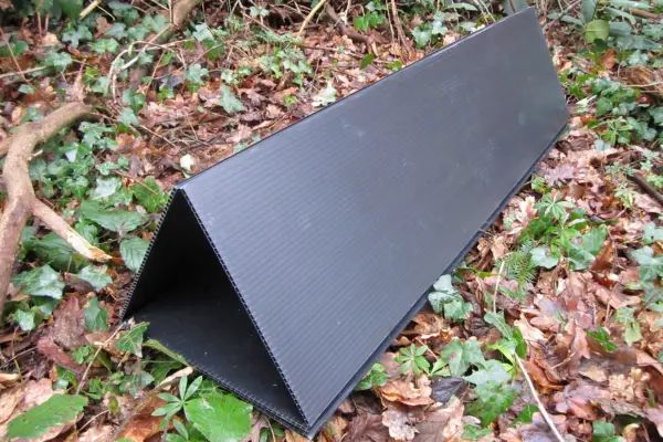 Triangular tunnel made from corrugated cardboard