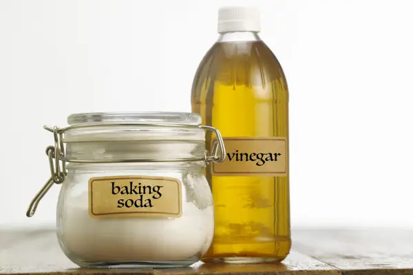 Organic, home-made weedkillers - vinegar and baking soda. Getty Images