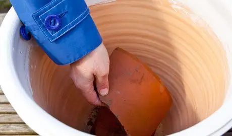 Adding crocks to the container