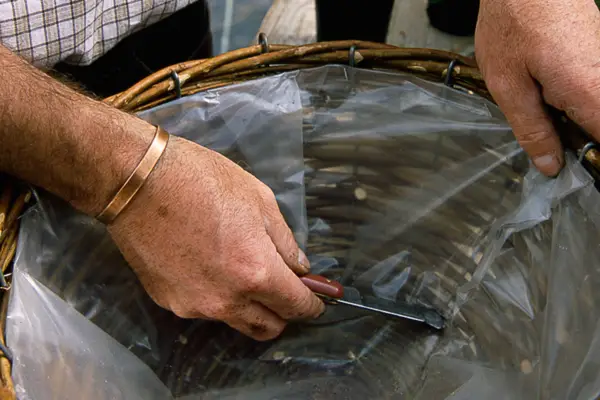 Adding drainage holes to the hanging basket