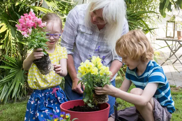 Children planting summer containers