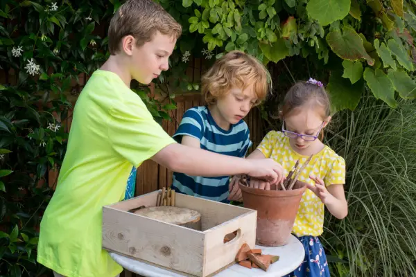 Children making a bug box