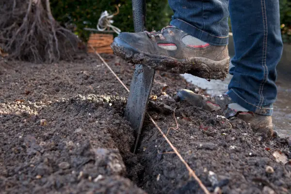 Digging a V-shaped trench