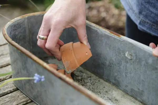 Adding crocks to the container