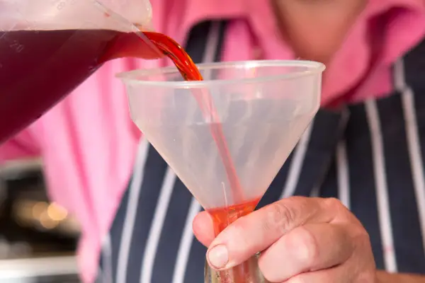 Pouring the mixture into bottles