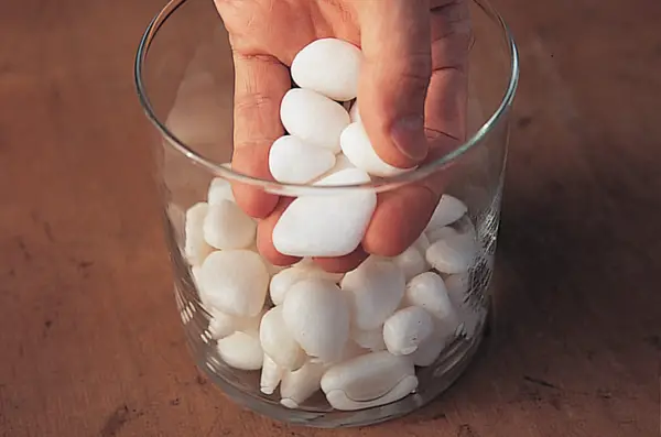 Adding pebbles to the glass jar