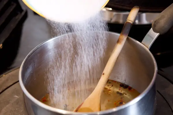 Adding the ingredients to the saucepan