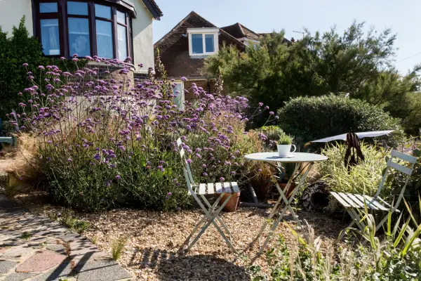 Table and chairs in front garden