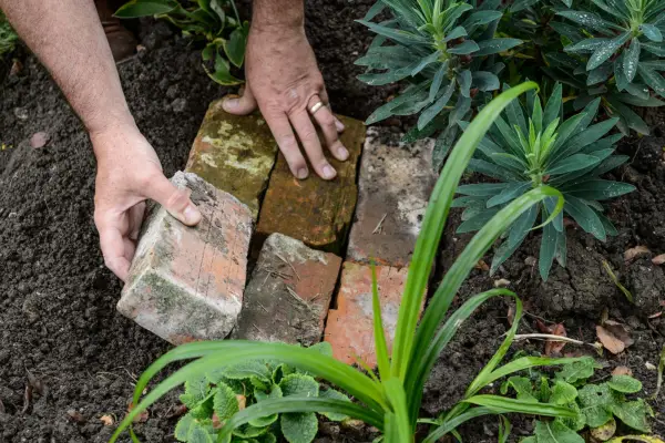 Laying bricks on the ground