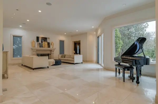 open floor plan view of living room with white tile floors