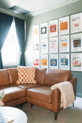 leather sectional and movie room wall art