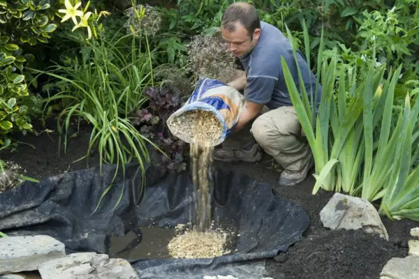 Adding grit or gravel to the pond liner