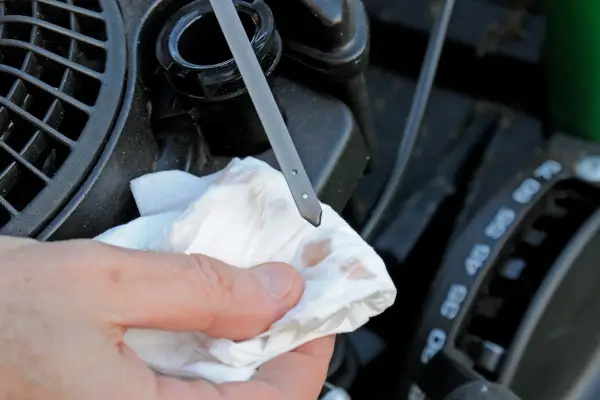 How to maintain your lawn mower - wiping the dipstick