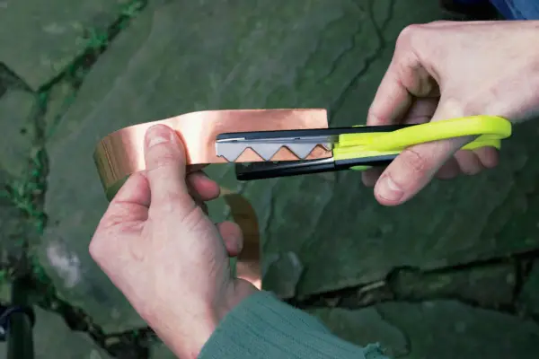 Cutting copper tape with pinking shears