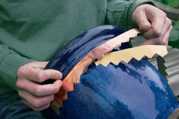 Sticking the copper tape to the pot