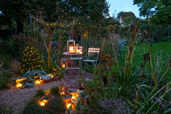 A variety of different lighting used to light up a patio in the evening. Sarah Cuttle