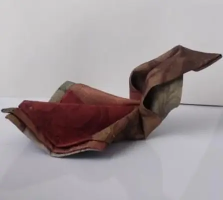 Cómo doblar una servilleta en un cisne