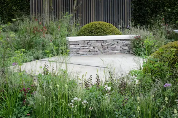Stone garden wall with seating slab