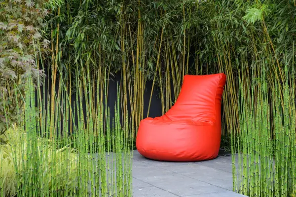 Orange bean bag in garden