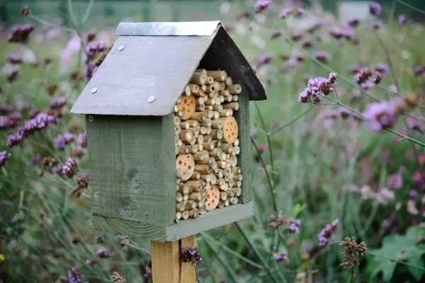 Bee hotel on post with slate roof