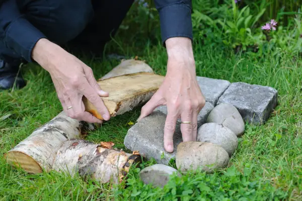 Stones and timber placed together on a lawn