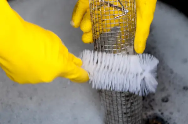 Cleaning a bird feeder