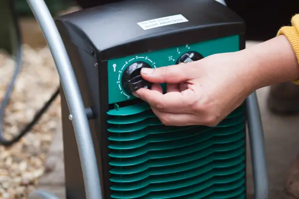 Turning on an electric heater in a greenhouse
