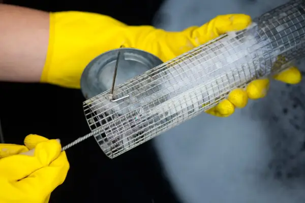 Washing a bird feeder