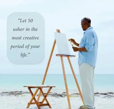 muž maľujúci na stojane